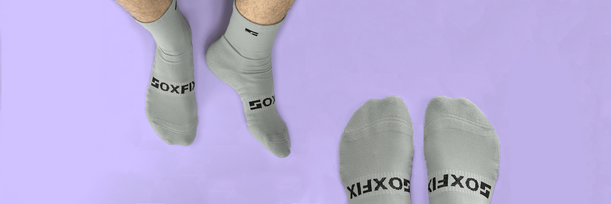 Feet wearing grey SoxFix socks